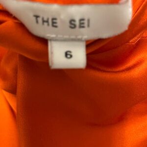 Tee length orange formal halter dress